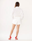 Conjunto blusa manga larga y short blanco con bordados